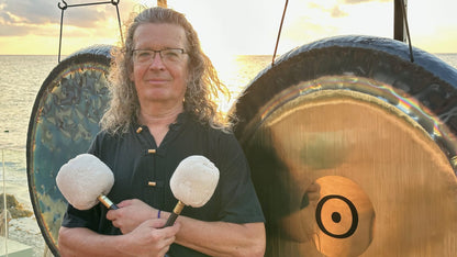 Jens Zygar with gongs at sunset